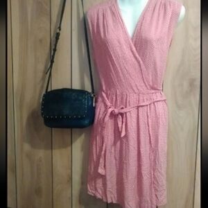 Red and white printed wrap dress by Fossil. Bodice is lined. Full wrap that ties